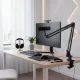 Microphone NearStream condensateur USB/XLR avec bras boom installé sur un bureau de streaming moderne avec clavier, souris, et casque audio